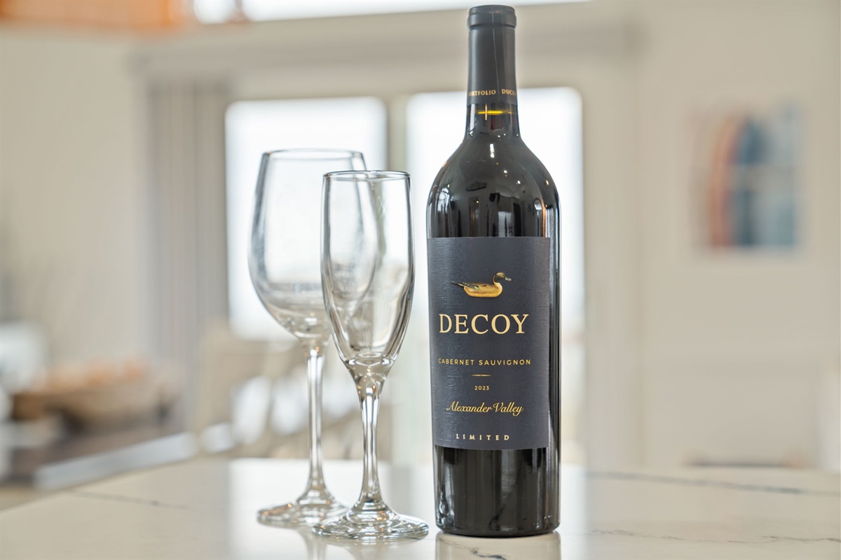 Small dining or bar setup with wine and glassware, nice for a quiet evening in.