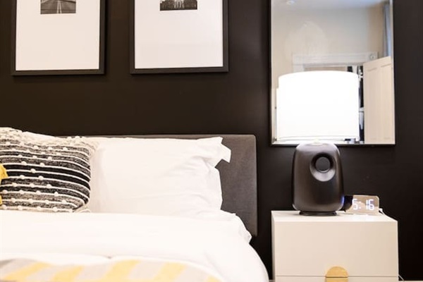 Spacious bedroom featuring a king bed, providing ample room for relaxation and comfort, perfect for a restful night's sleep.