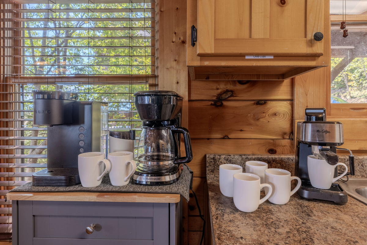 Coffee station has a regular 10 cup pot, single cup coffee maker and an espresso machine