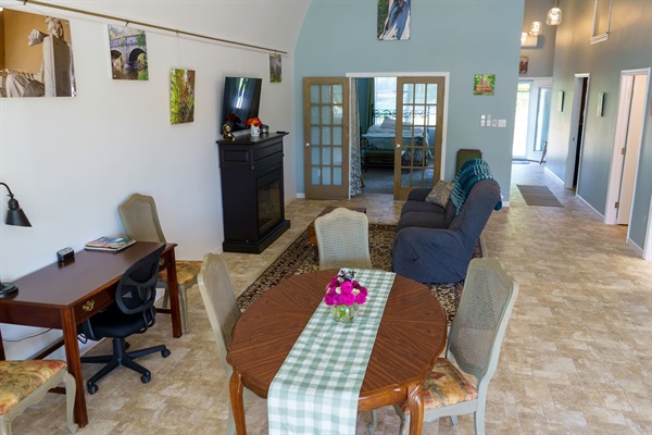 Dining table, work desk, e-fireplace, LaZBoy couch, TV. Photography is Emily’s, it is for sale, please inquire. 