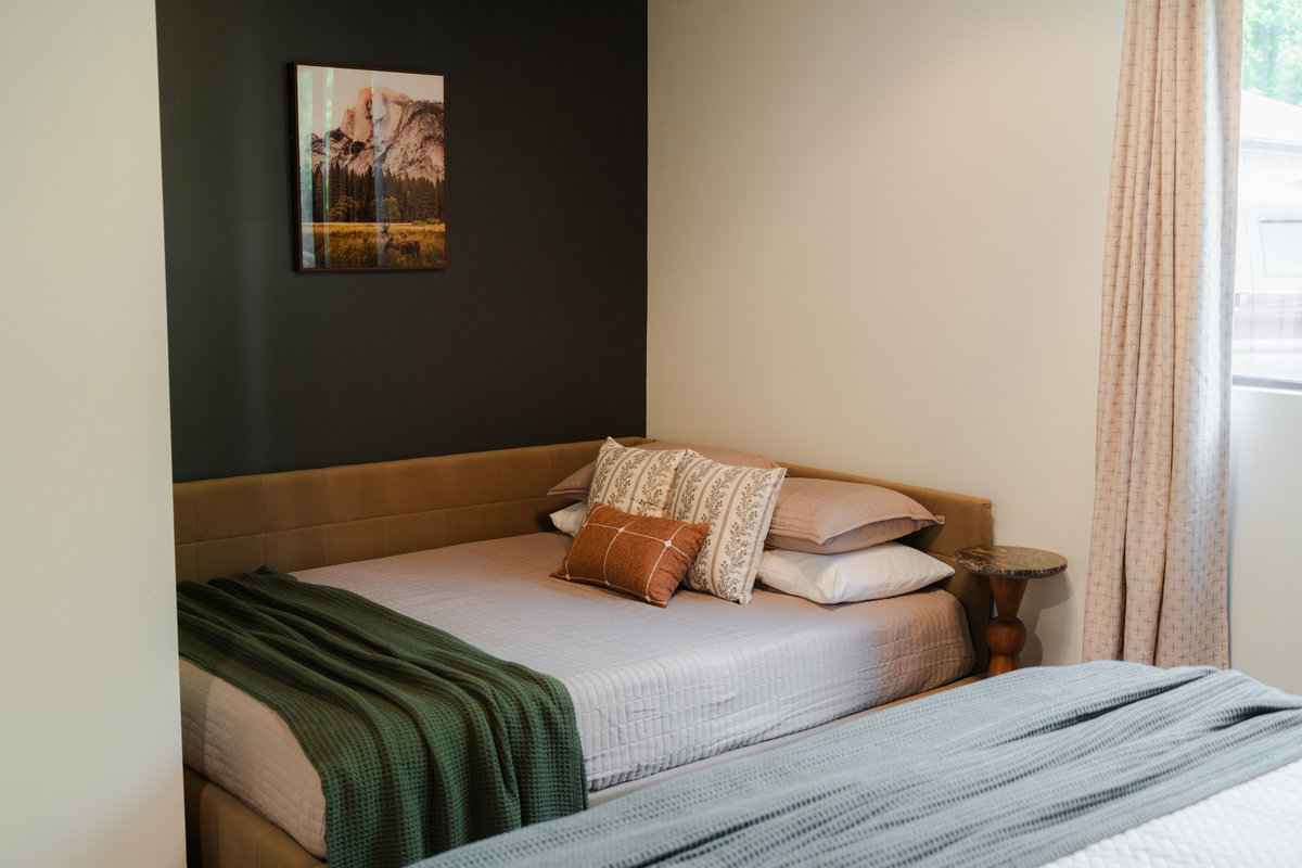 King bedroom with a king bed and queen daybed, offering additional sleeping space for families and groups.