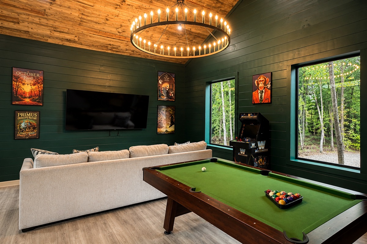 Game Room: Challenge friends to a match while enjoying vibrant views and retro arcade fun!