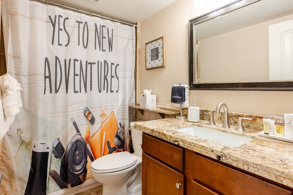 Resort like amenities including shampoo, conditioner, soaps, body lotion, Q-Tips, cotton balls, hair dryer, and makeup remover cloths. 