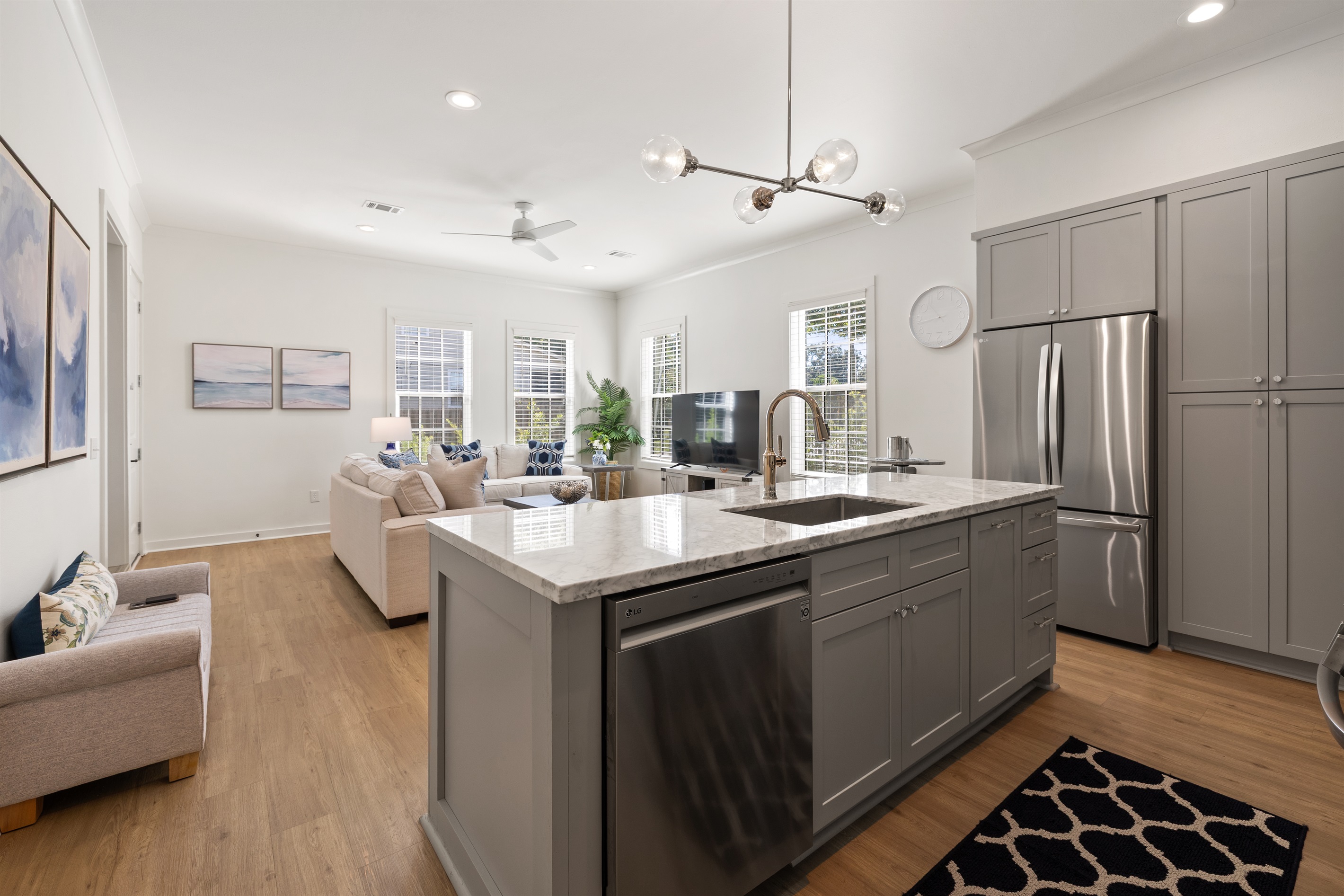 Fully equipped kitchen with marble countertops and stainless steel appliances.