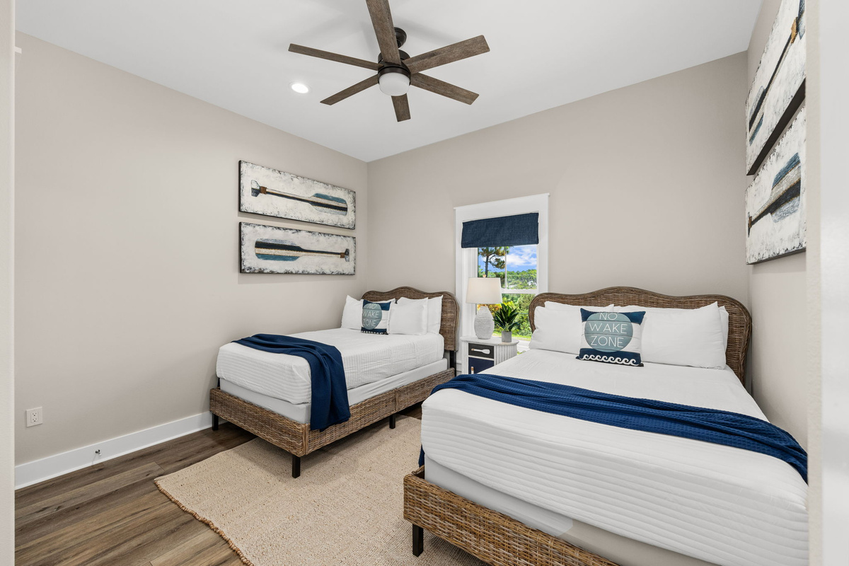 Perfect for another family or older kids, this bedroom features two comfortable full beds.