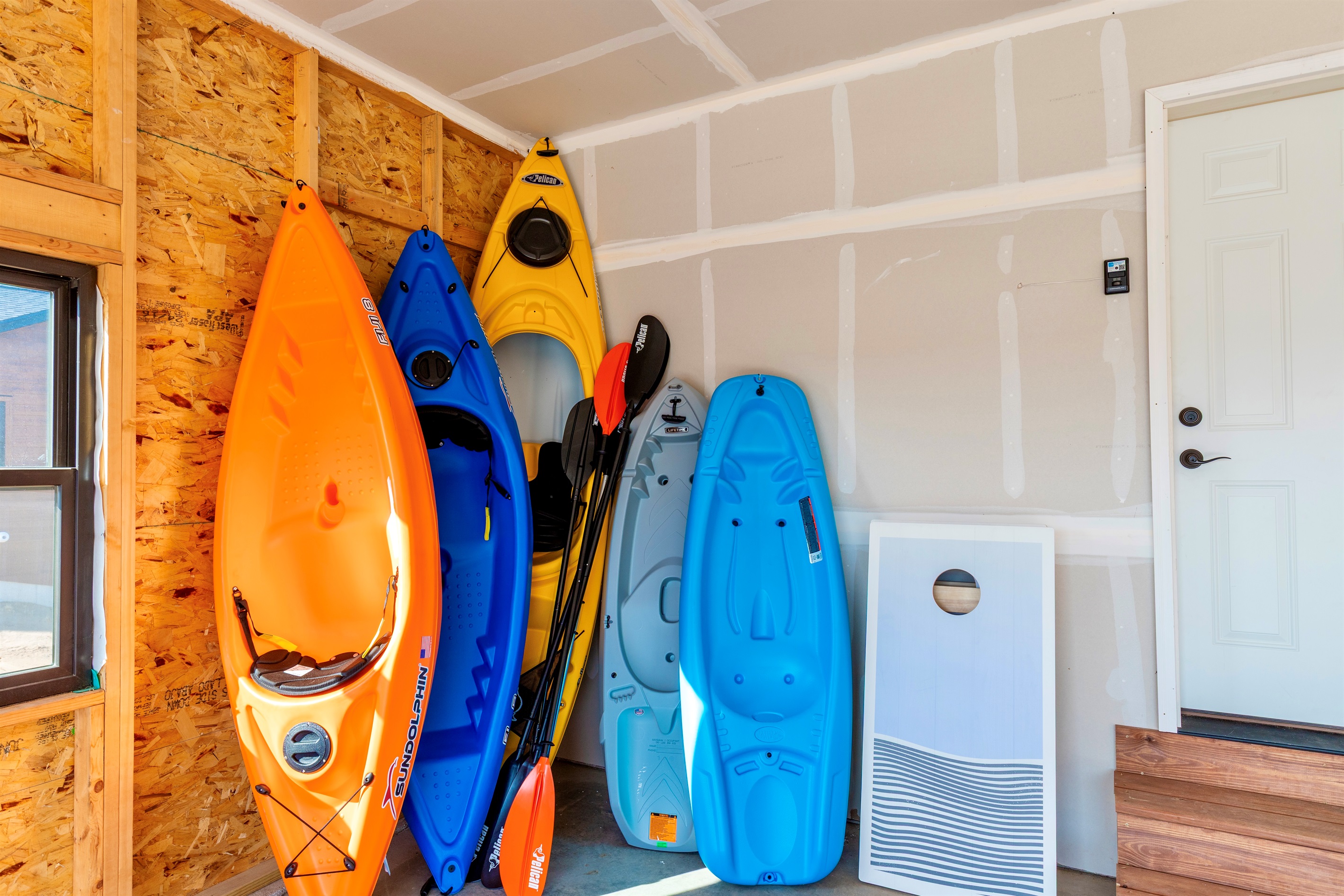 Multiple outdoor games, kayaks, *not pictured but available is a stand up paddle board.