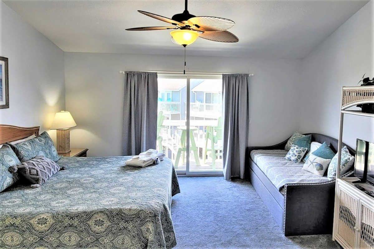 Your king suite has a daybed with trundle tucked in &mdash; the extra sleeping space your group didn't know they needed.