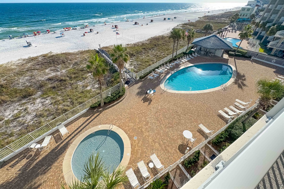 Savor the best of outdoor living with a beautifully designed courtyard, inviting pools, and immediate access to the stunning coastline. An idyllic setting for relaxation.