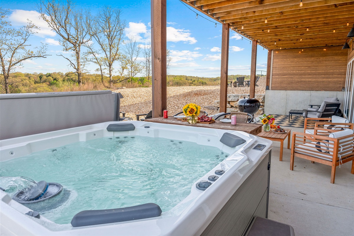 Relax in the private hot tub on the patio.