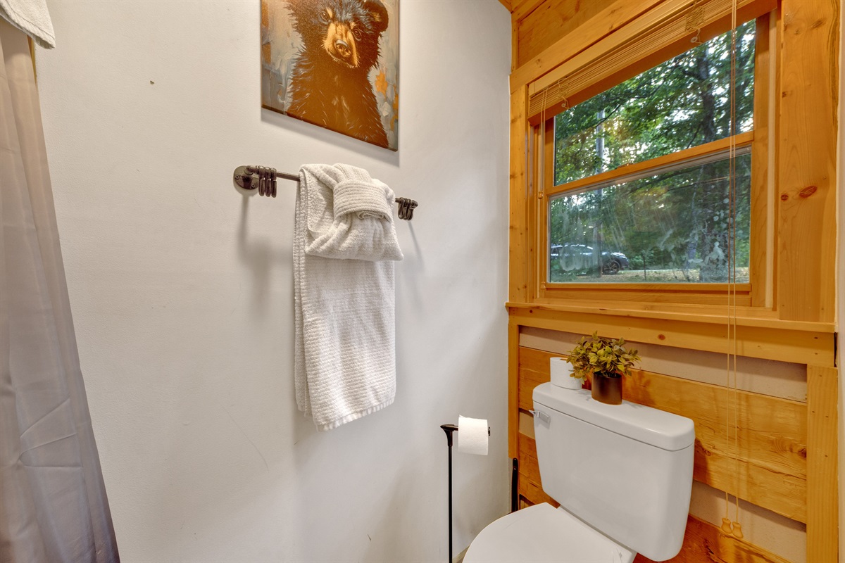 Clean, well-stocked bathroom with fluffy towels provided