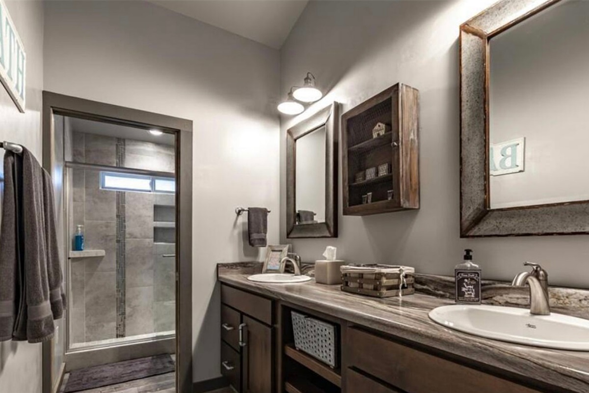 Spacious bathroom with double vanity and walk-in shower.