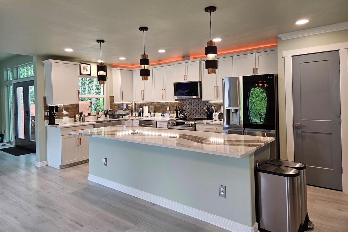 Kitchen includes microwave, dishwasher, oven, range, and refrigerator.