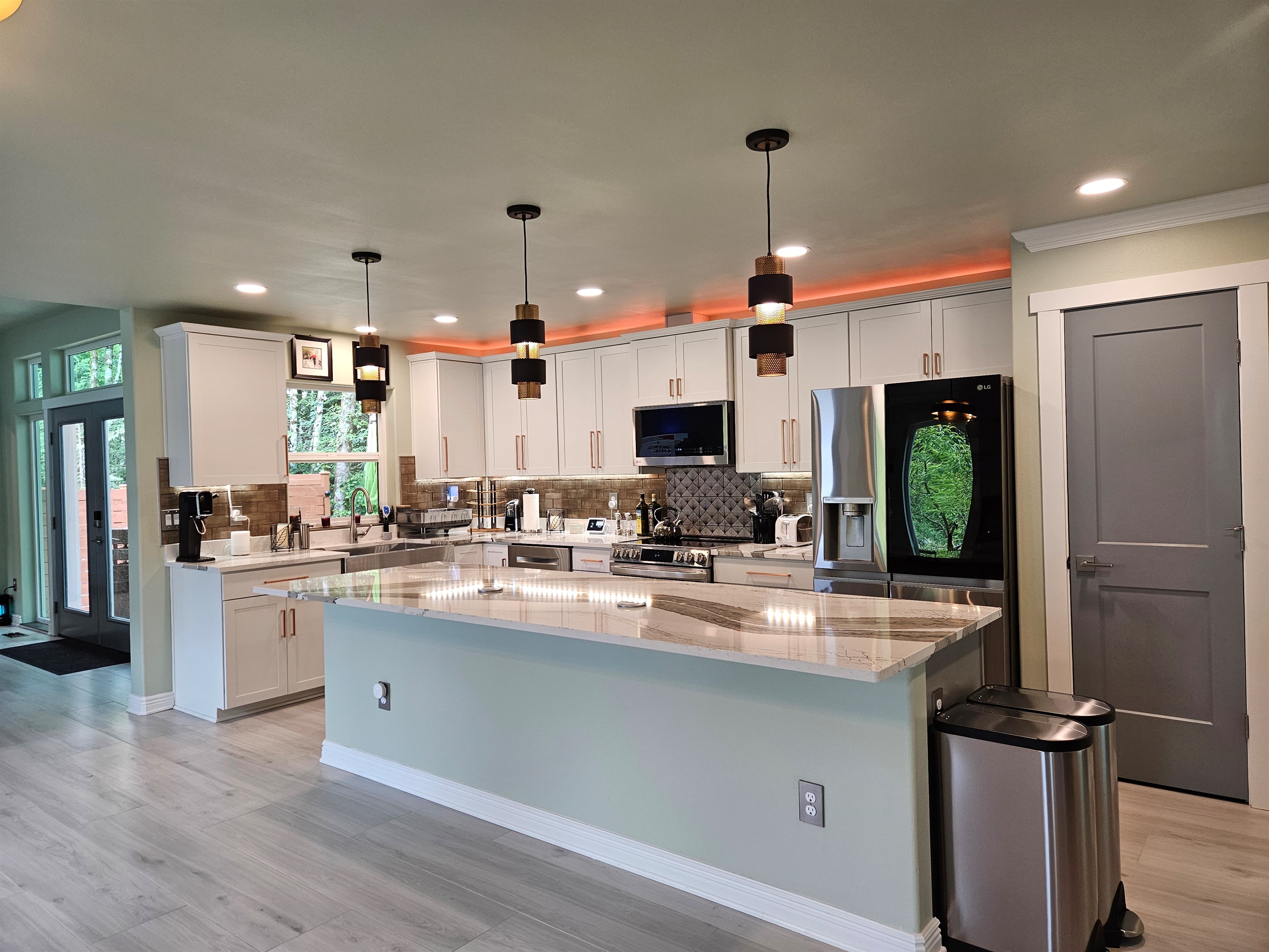 Kitchen includes microwave, dishwasher, oven, range, and refrigerator.