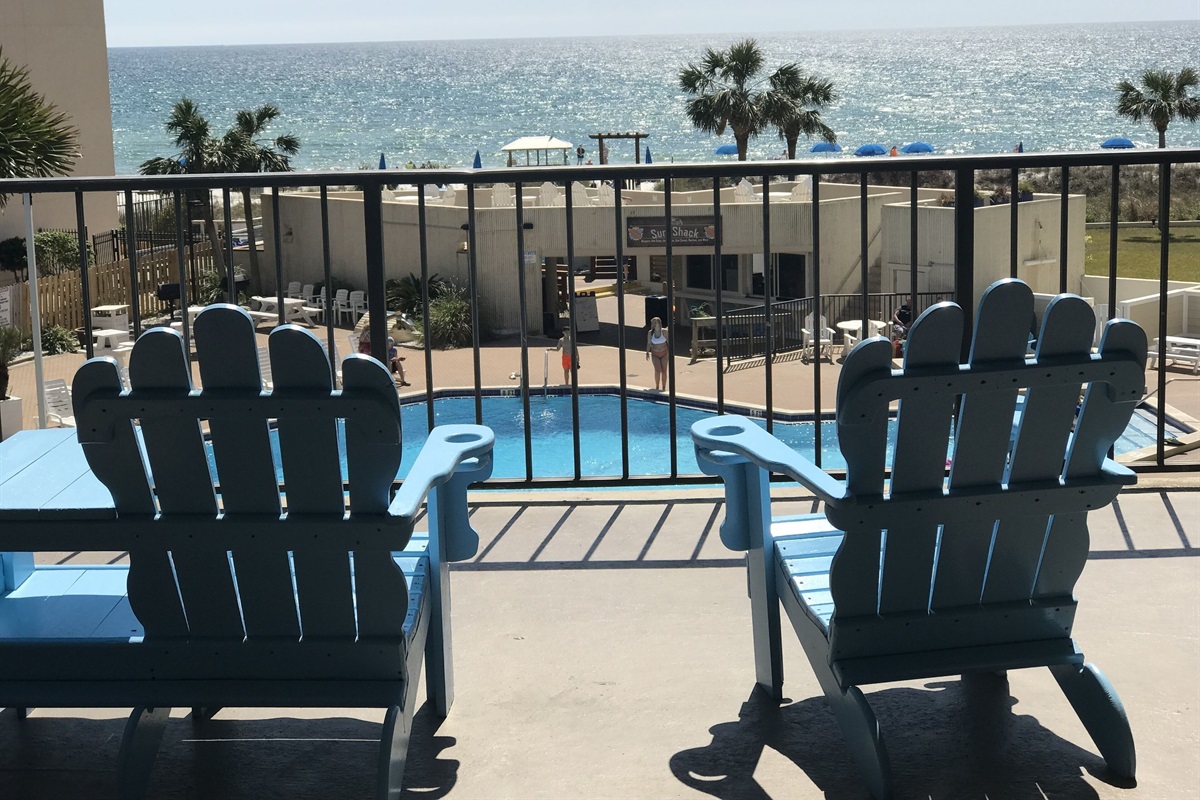 Outside balconies overlooking the pool and gulf