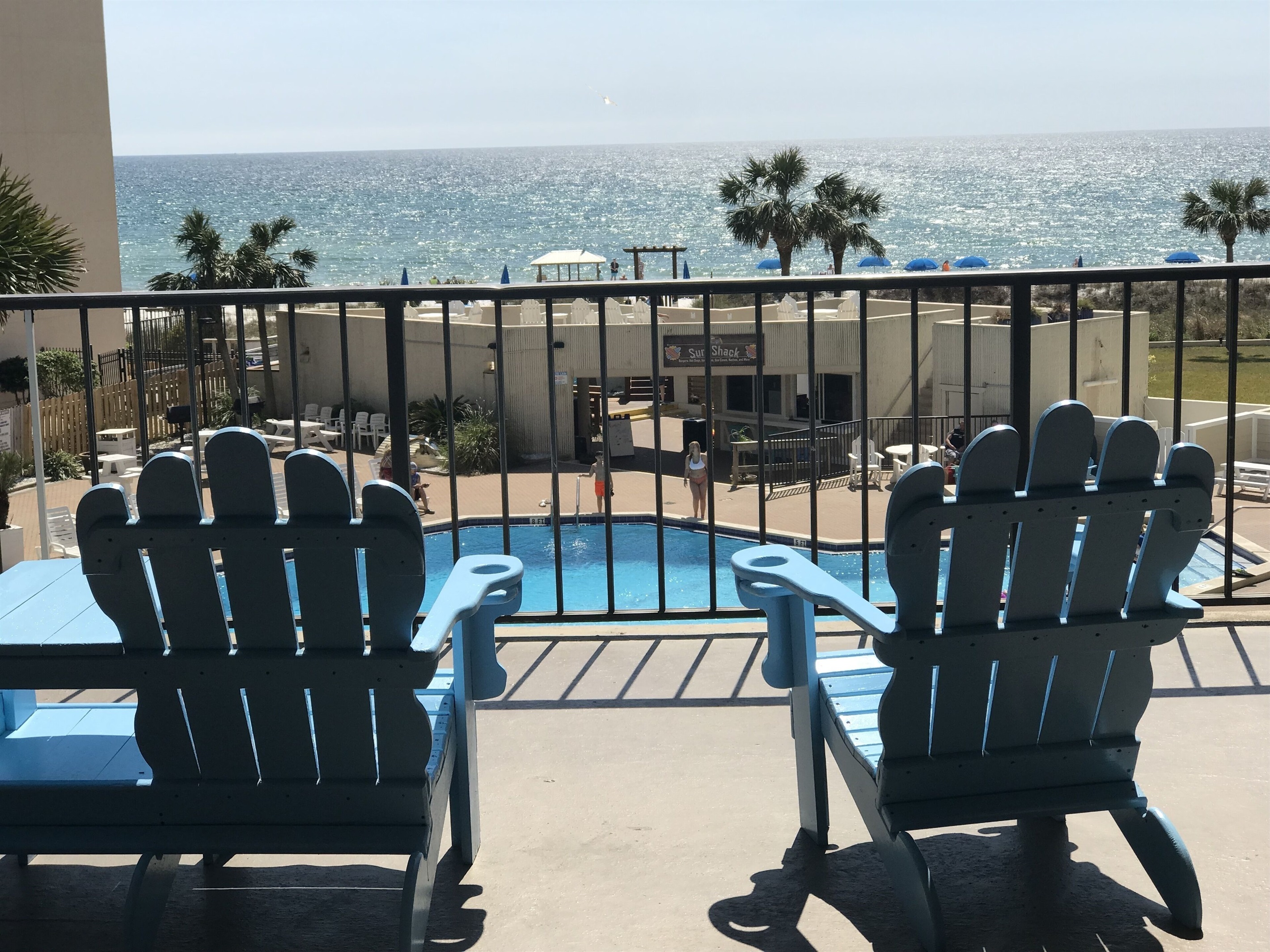 Outside balconies overlooking the pool and gulf