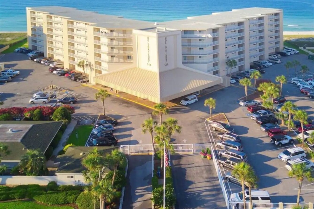 Holiday Surf & Racquet Club is a mid-rise condo with gated access, plenty of parking, and security