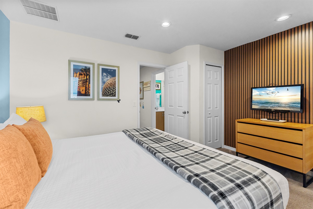 Primary Bedroom with a TV.