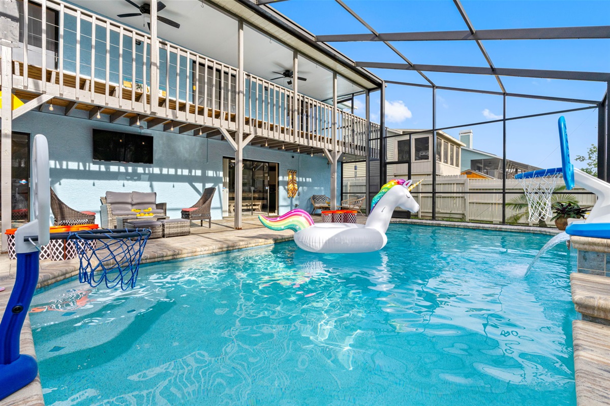Take a dip in the crystal-clear waters of this inviting pool, framed by elegant paver decking and highlighted by a soothing cascading waterfall.