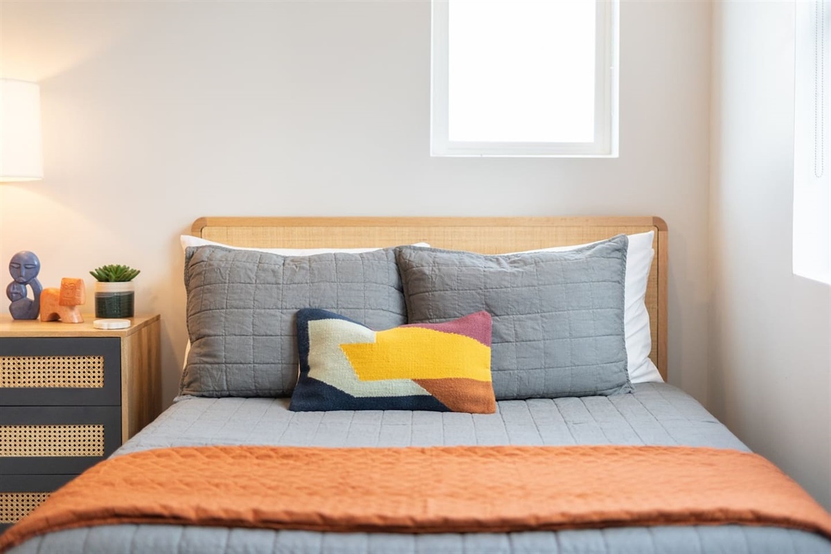 Unwind in this spacious room featuring two double beds and a TV, providing a comfortable and convenient space for relaxation and entertainment during your stay.