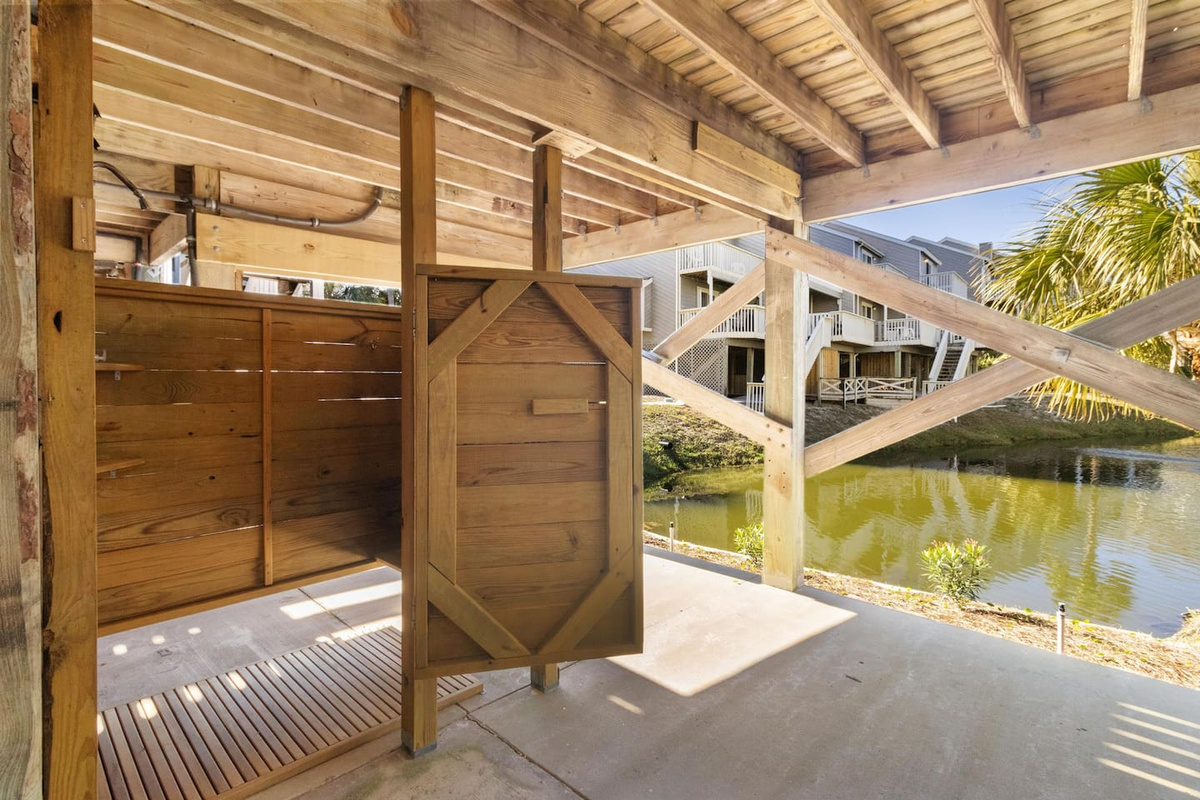 Step into the enclosed outdoor shower and rinse off the beach salt before heading upstairs &mdash; sandy feet stay outside.