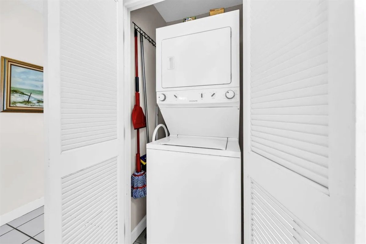 Stackable washer and dryer inside the condo