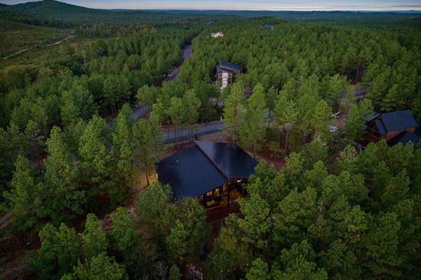 Scenic woodland escape with glowing sunset over rolling hills