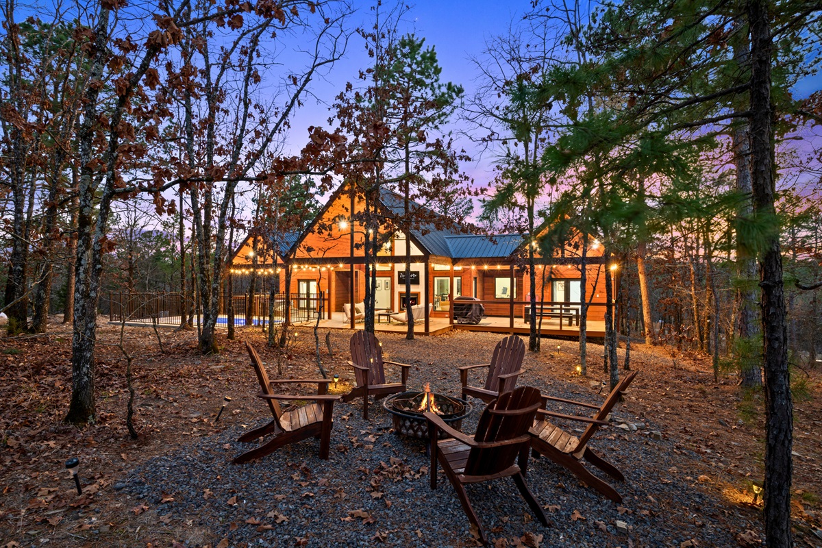 Out by the fire pit, Adirondack chairs circle the flames, creating the perfect place to share stories, roast marshmallows, and enjoy quiet evenings under the stars.