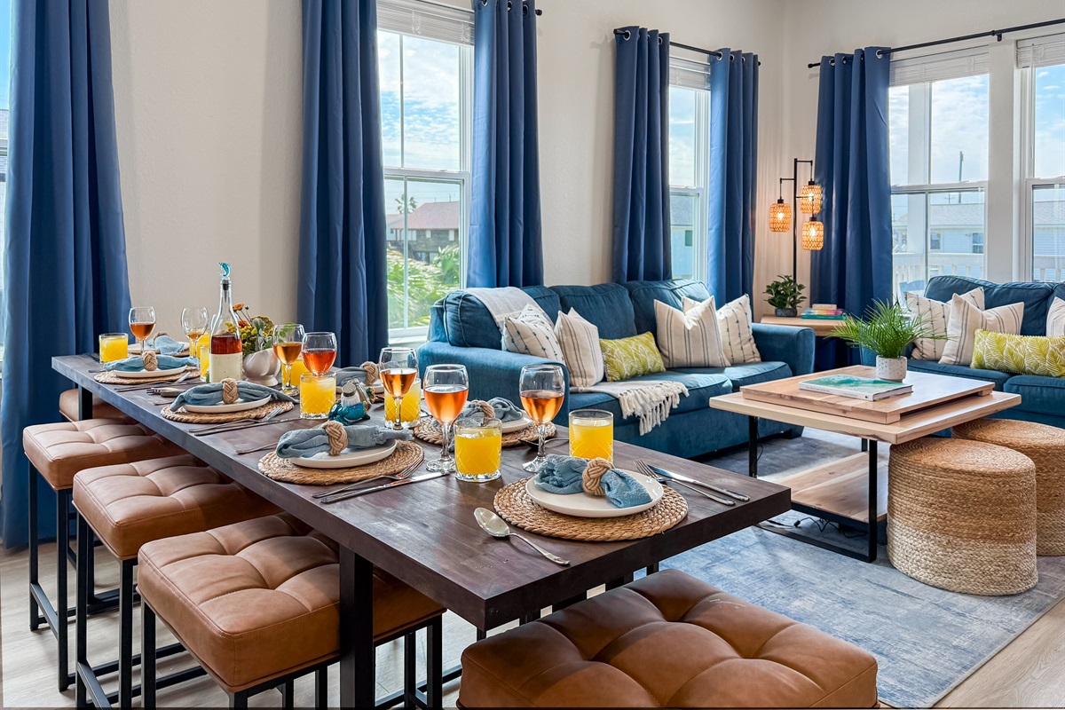 The dining table seats 8 people and is perfectly located between the living room and the kitchen.