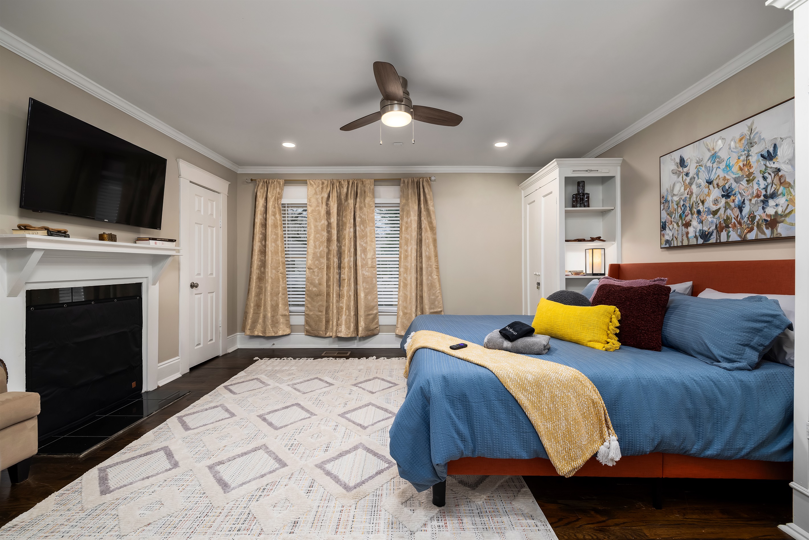 Retreat to the king bedroom, a haven of rest offering a plush king-sized bed, elegantly appointed decor, and a private TV for leisurely viewing, creating a perfect escape for relaxation and re