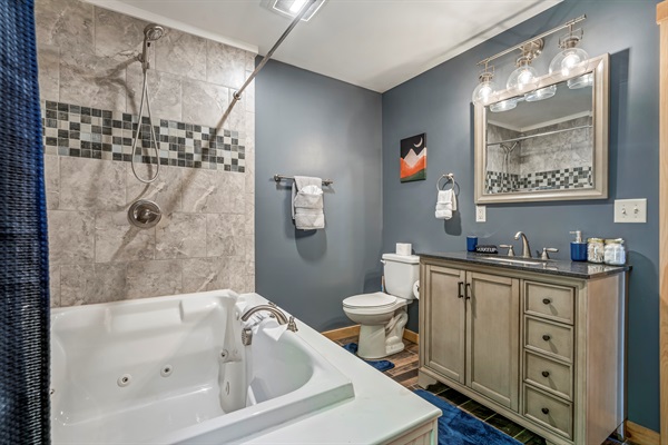 Treat yourself to a spa-like experience in the main floor bathroom, featuring a deep jacuzzi tub.