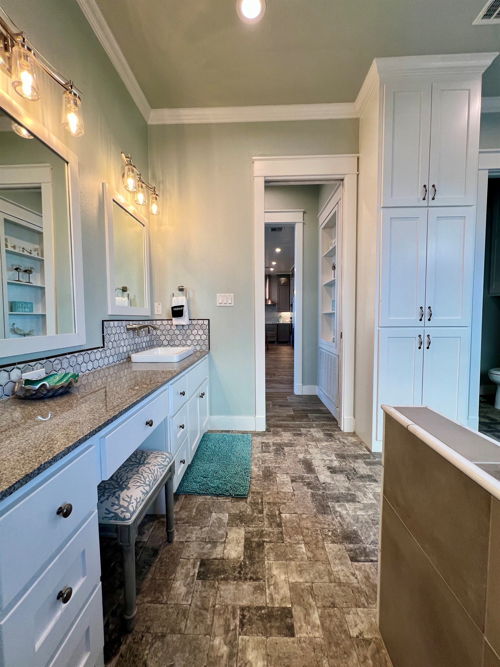 Crystal Paradise Bathroom 2 Ensuite: Guests will appreciate the sleek vanity, complete with storage and a large mirror for added convenience.