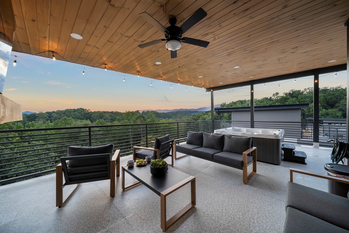 Private rooftop terrace with hot tub, fireplace, and breathtaking sunrise + mountain views.