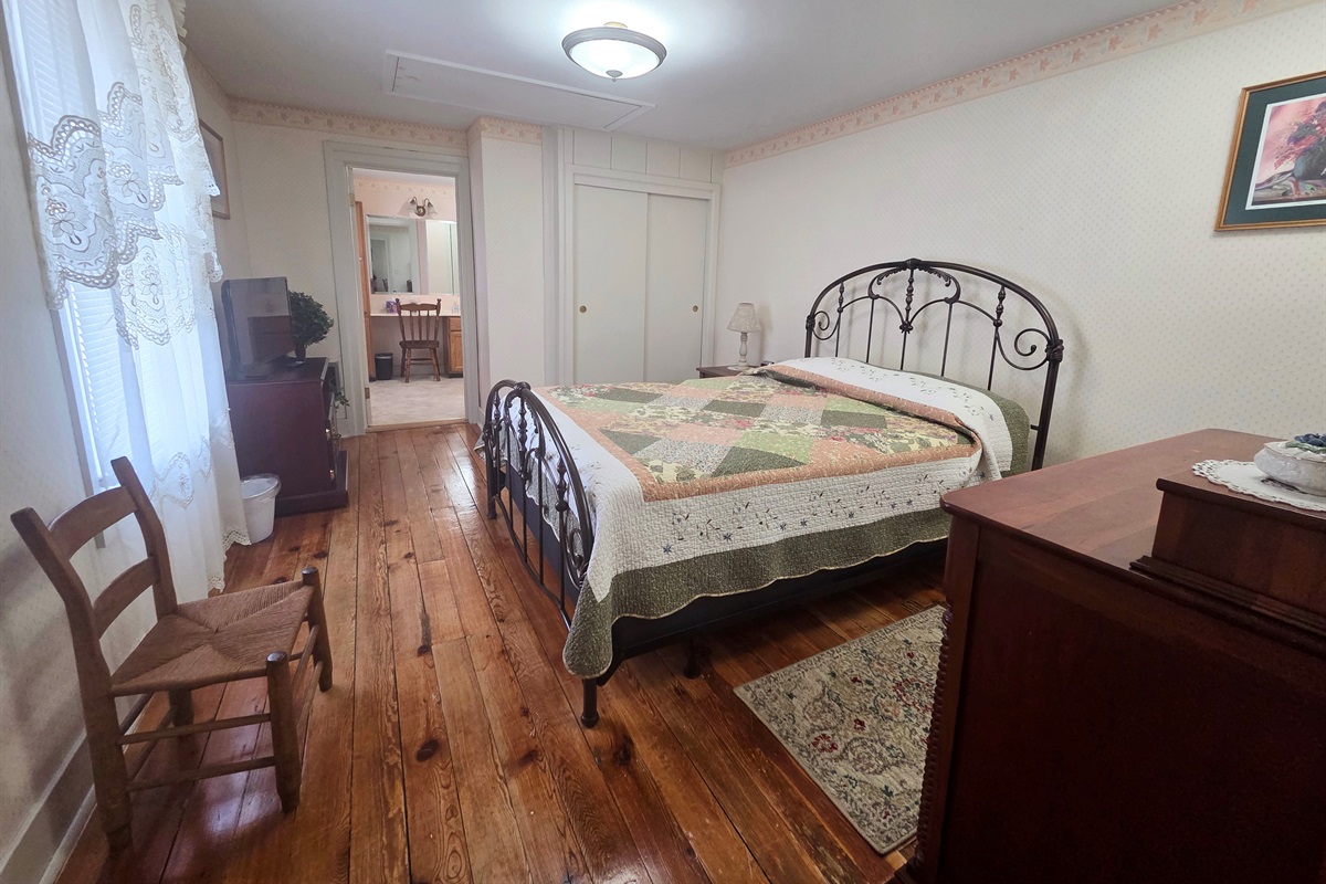 Second Upstairs bedroom featuring a comfortable full bed, with convenient access to the shared Jack-and-Jill bathroom.