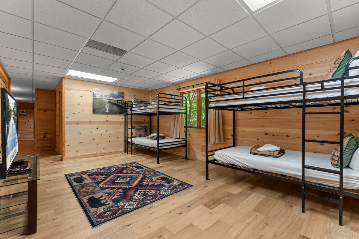 Bunk area with 60 inch smart TV.