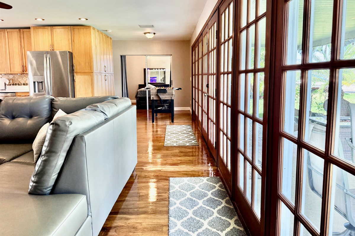 With natural light streaming in, soft earth tones, and greenery throughout, this living area offers a serene retreat to unwind after a day in the sun.