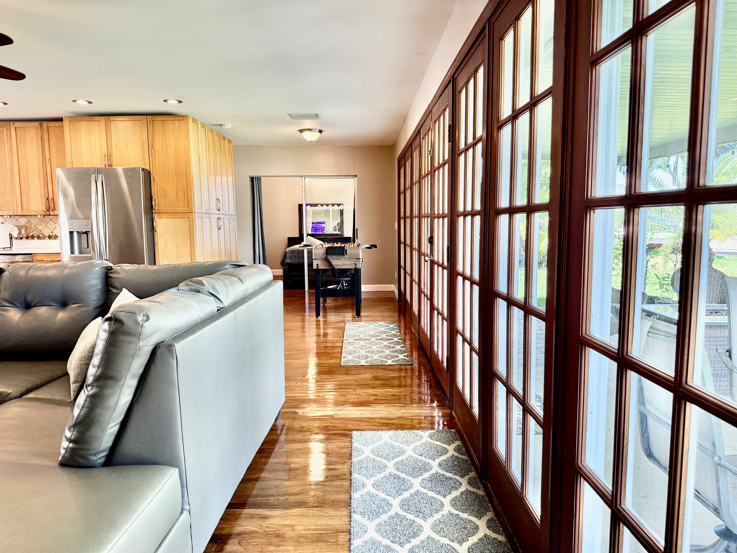 With natural light streaming in, soft earth tones, and greenery throughout, this living area offers a serene retreat to unwind after a day in the sun.
