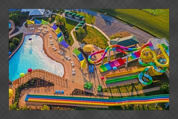 The outdoor waterpark has a dozen slides, a wave pool, and mountain views — included with your resort access all summer long.