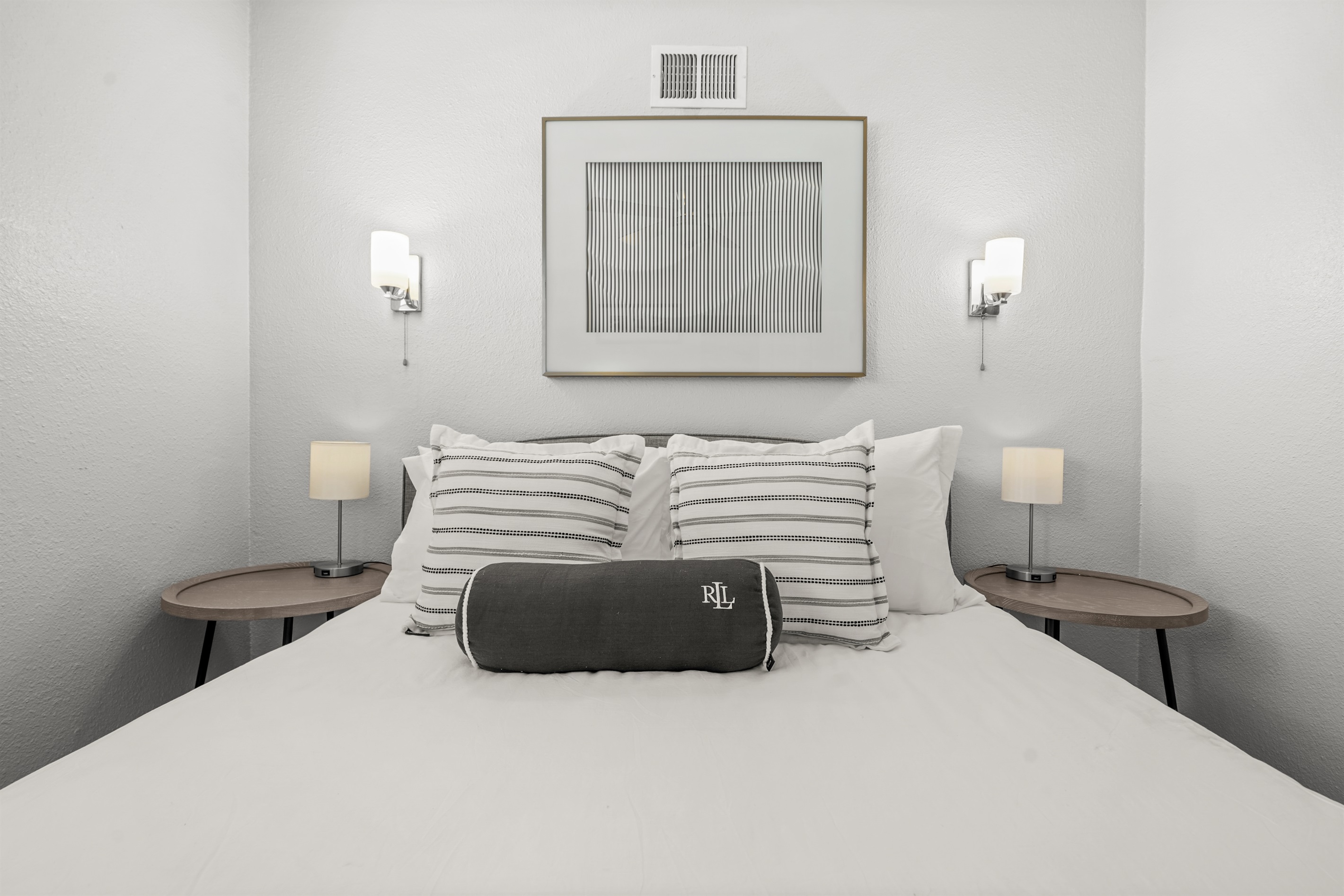 Comfortable upstairs bedroom with a queen bed and closet space for guest belongings.