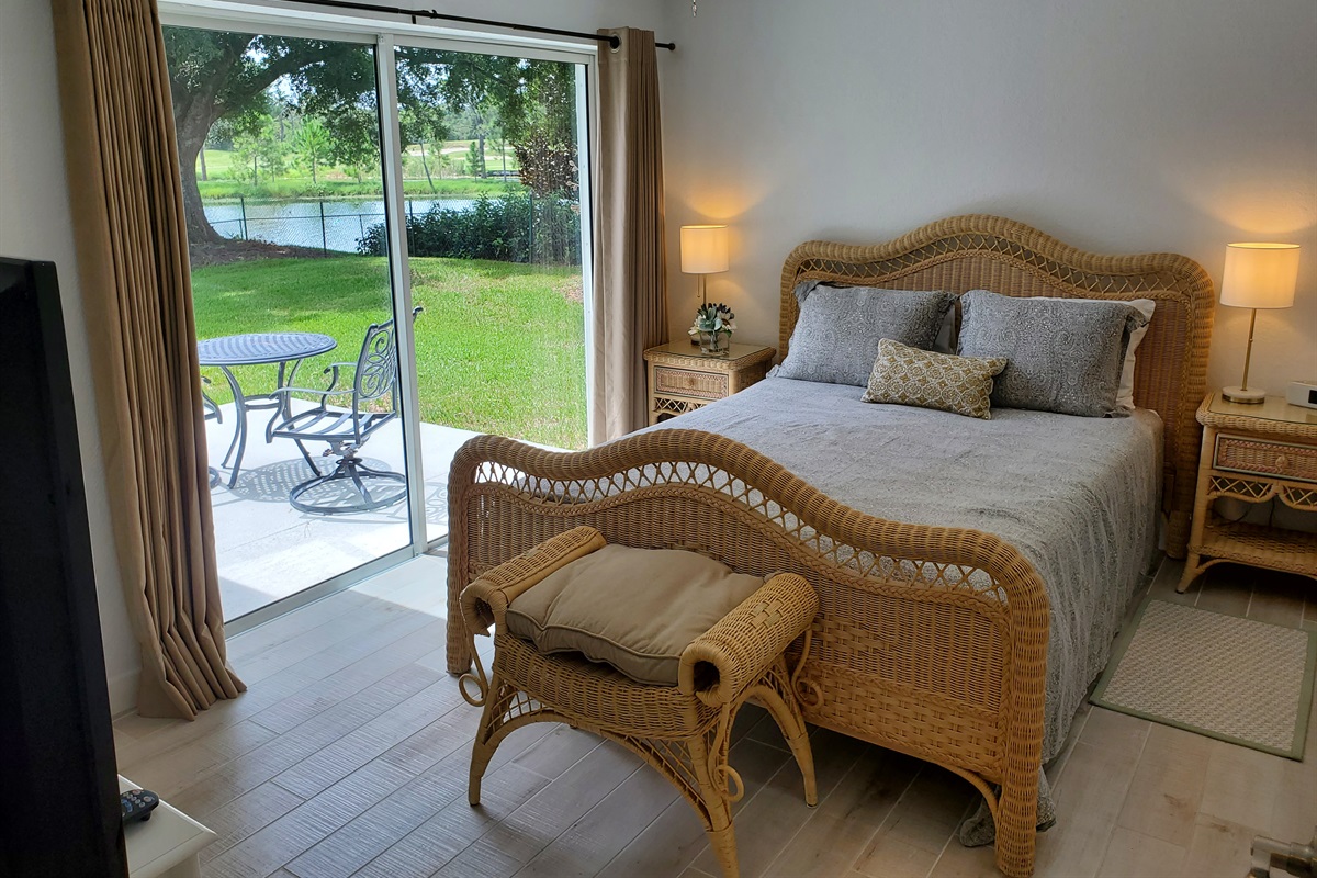 Queen bedroom with private bath and access to patio