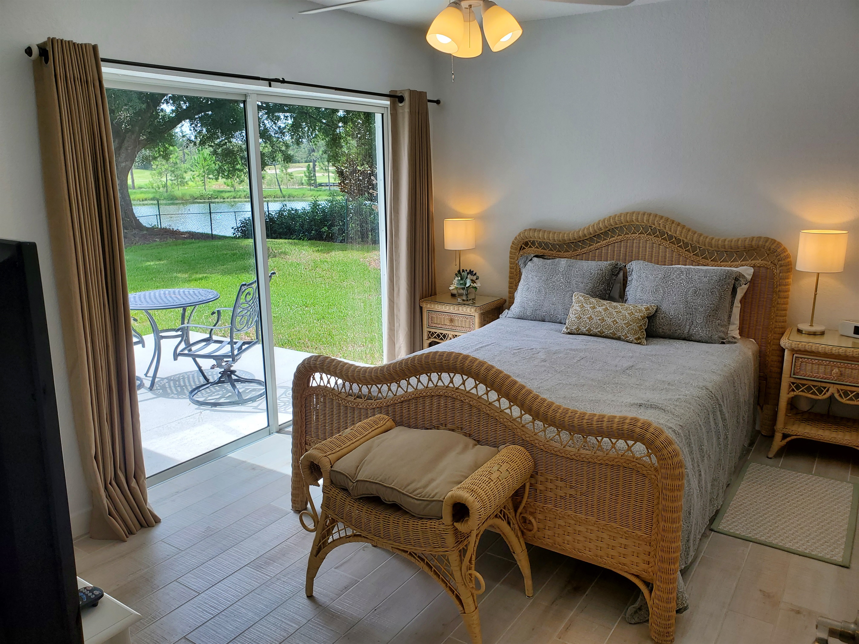 Queen bedroom with private bath and access to patio