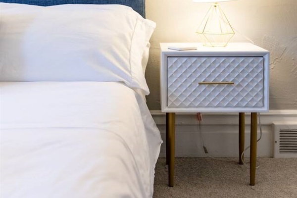 Bed side table and lamp.