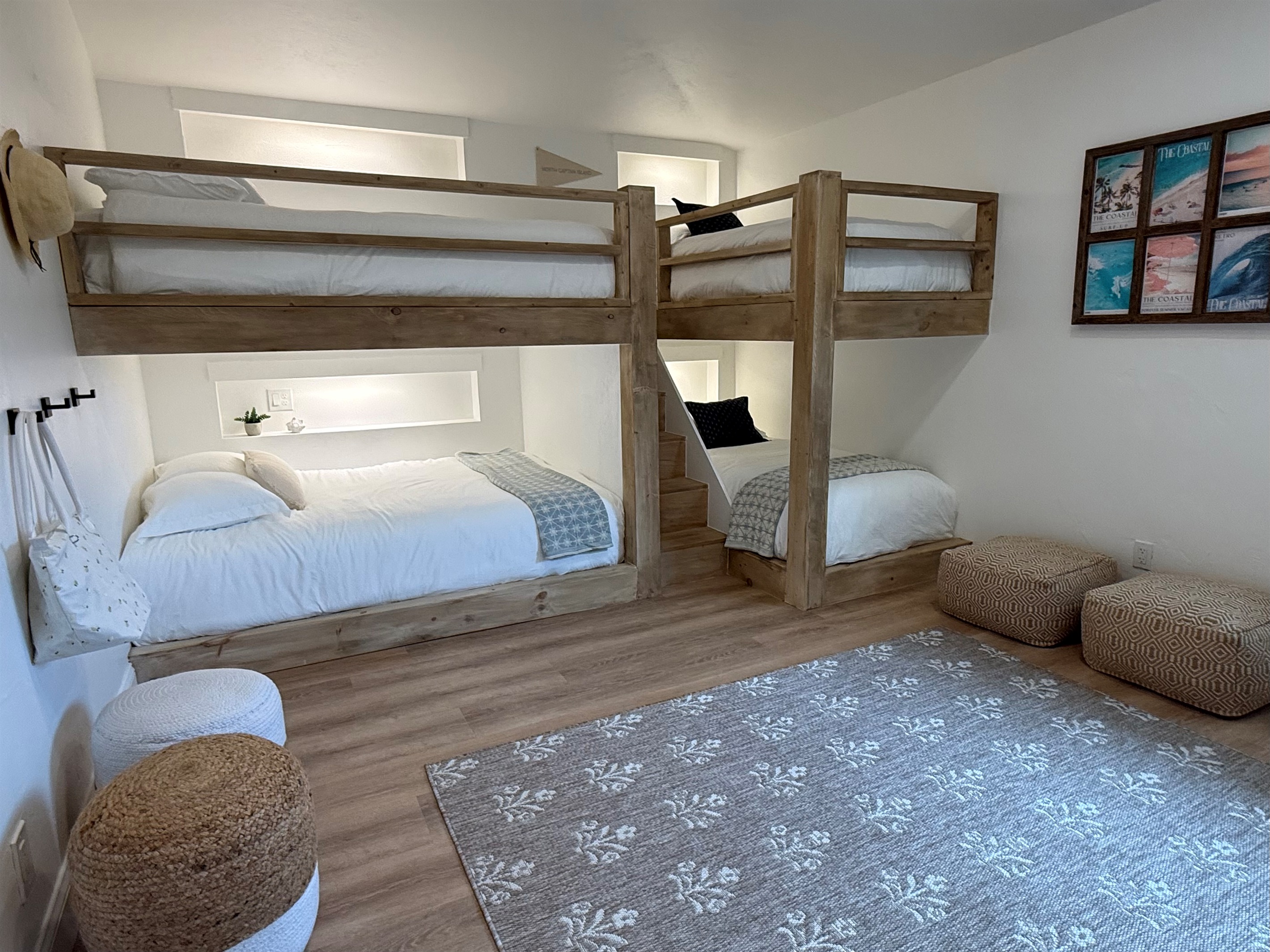 Thoughtfully designed custom build bunk room. Two Queen and Two Twin XL beds
