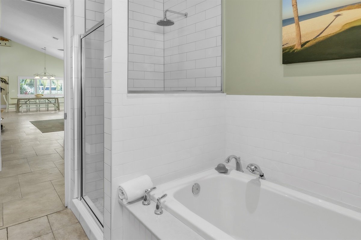 Bathroom with walk-in shower and bath tub – AMI Beach House