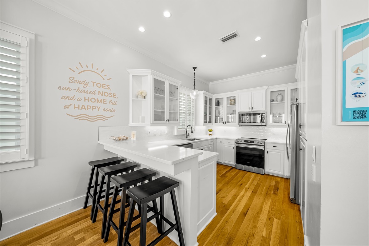 Remodeled Kitchen with granite countertops, stainless appliances - cook delicious meals and dine while overlooking the Gulf of Mexico!