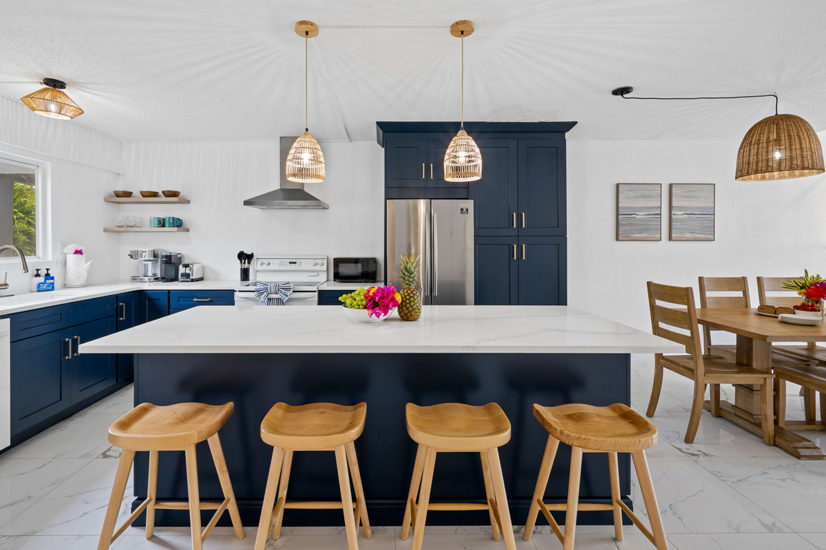 The spacious kitchen opens seamlessly into the dining and living areas.