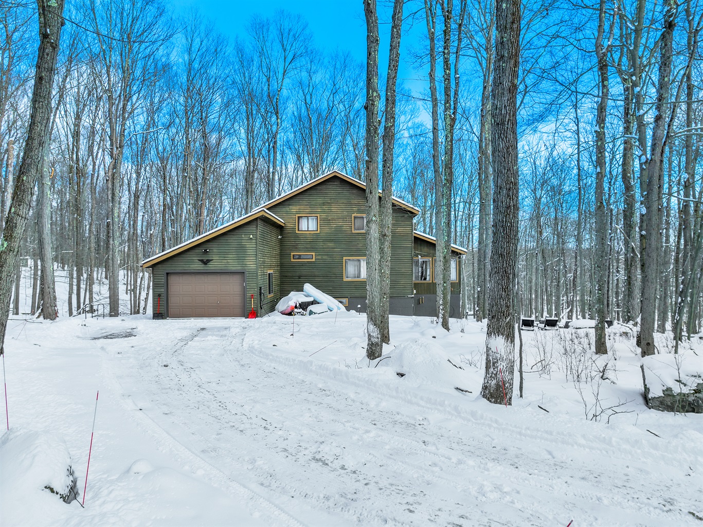 “Snowy bliss — your secluded winter escape awaits among the trees.”