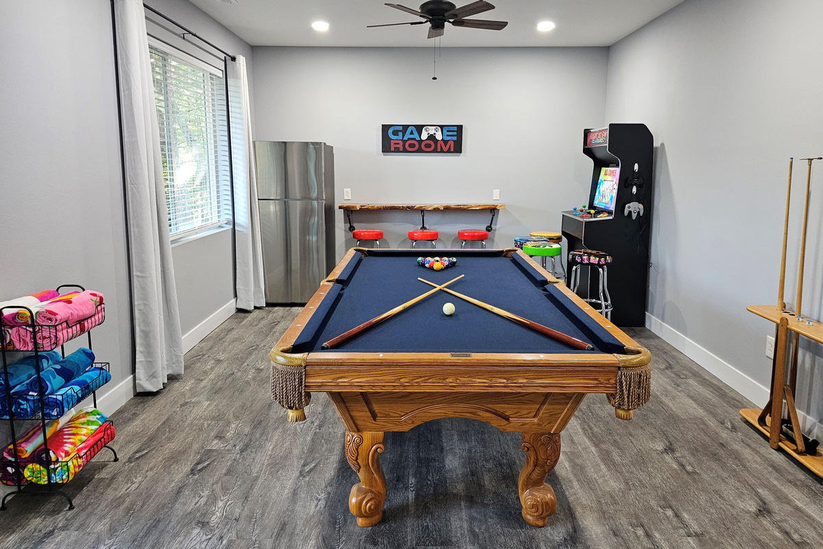Game room with pool table for friendly family competition.