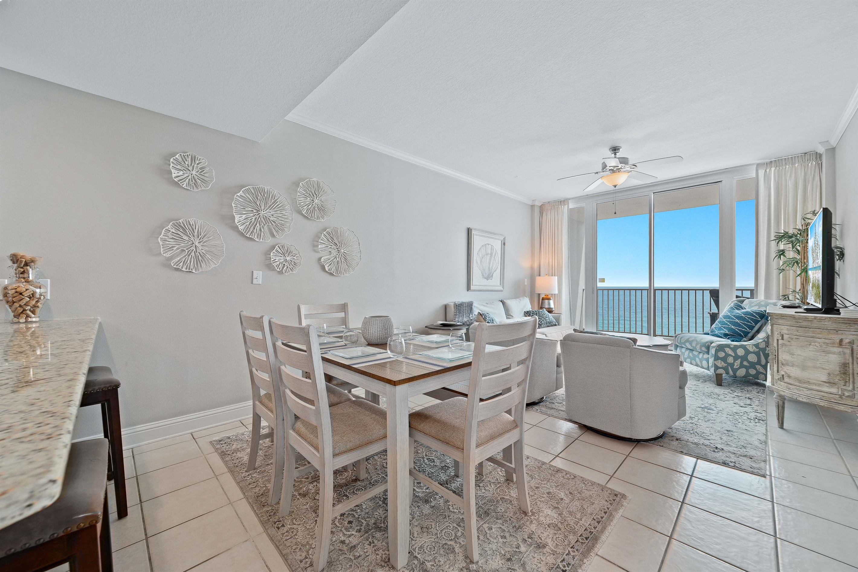 A comfortable living room with ample seating, flowing into a dining area, ideal for everyday living and gatherings.