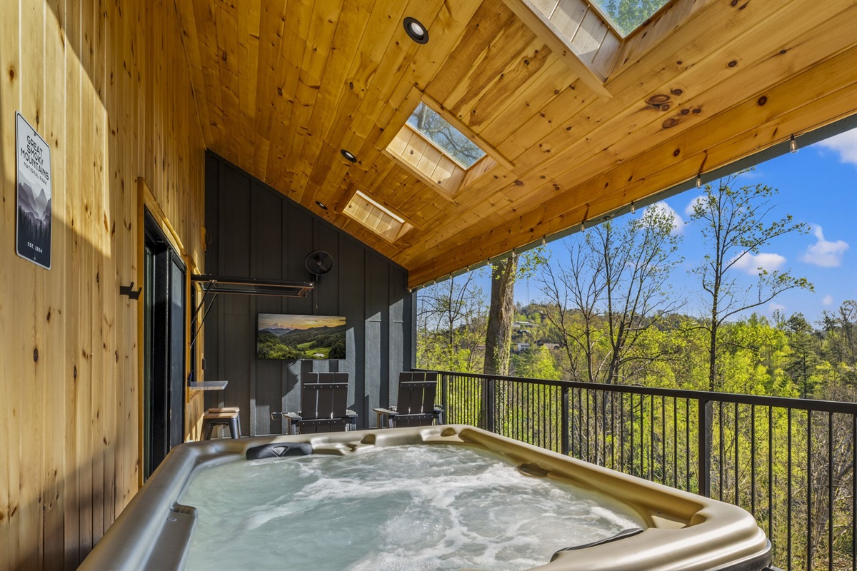 Enjoy a soak in the hot tub while watching TV