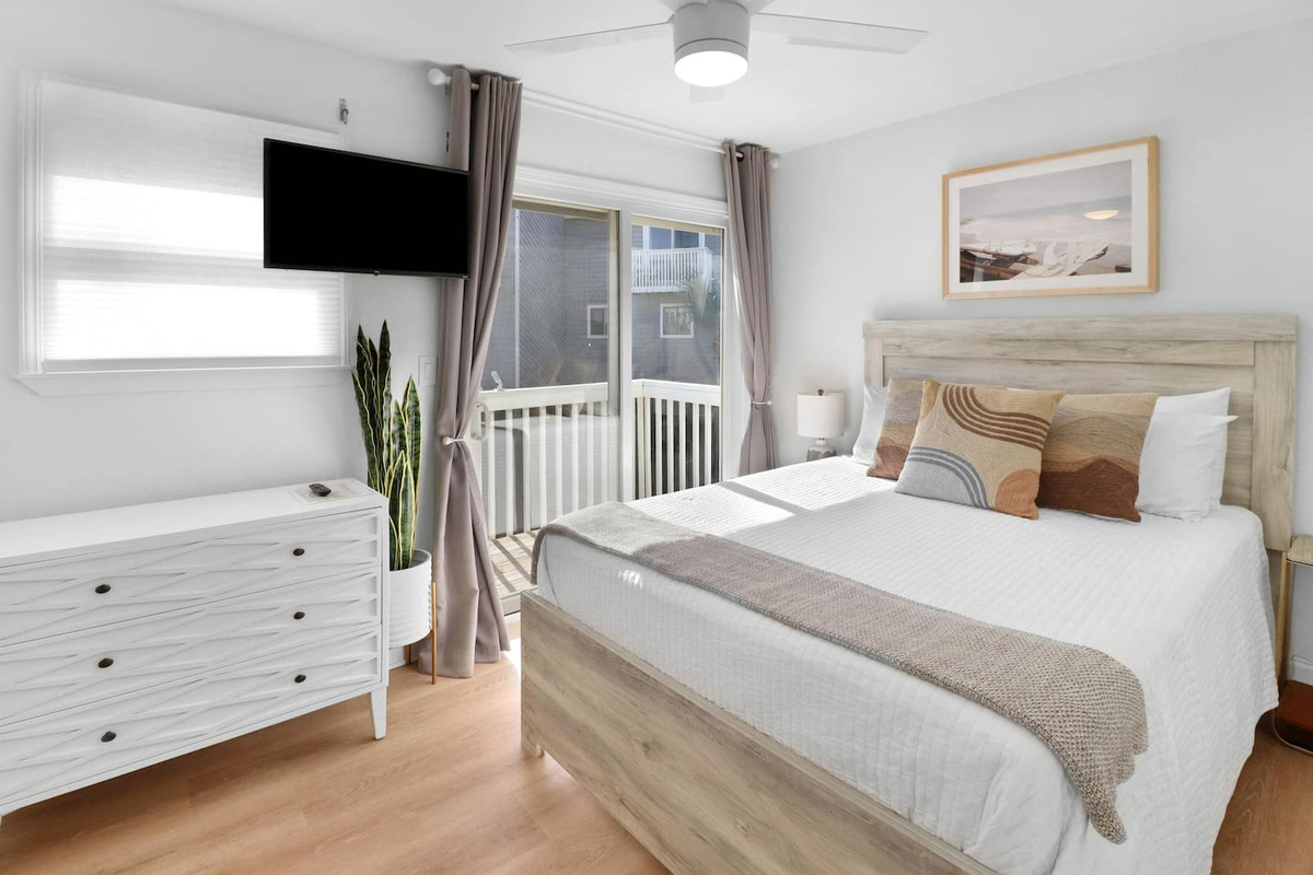 Sleep on the main level in the queen bedroom &mdash; your own Smart TV and steps to the front door when morning comes.